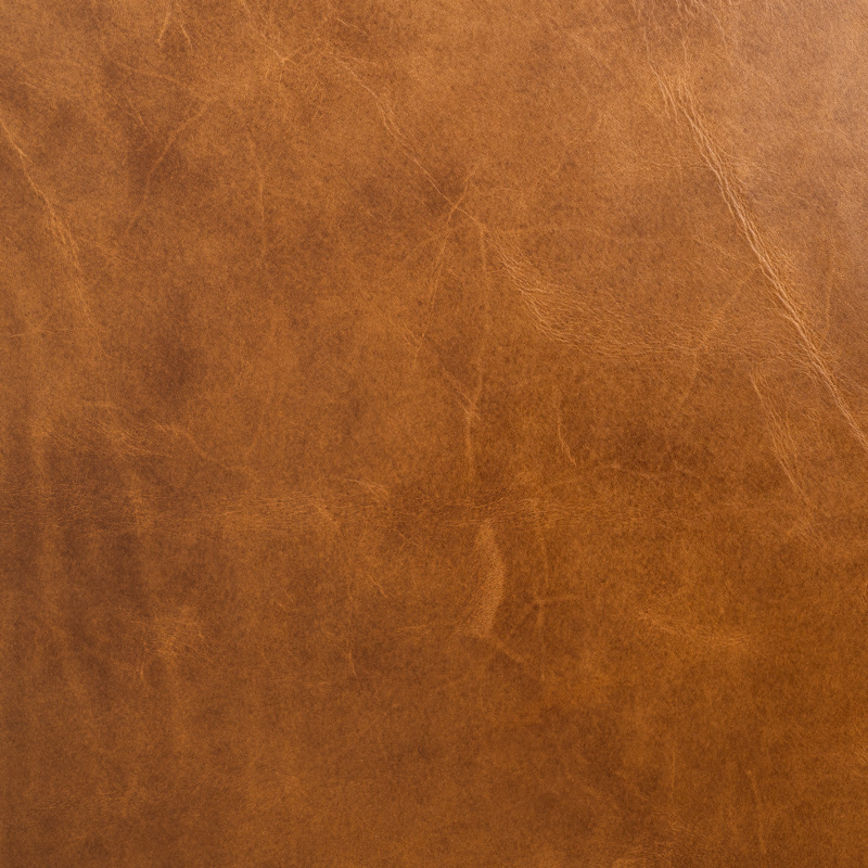 Tan – rich brown rustic leather swatch with a natural, textured finish.